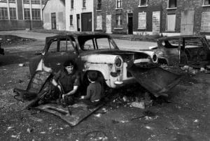 A British soldier speaking with young boy. Usually children and soldiers are on opposite sides during street riots. Northern Ireland. Belfast. 1971.