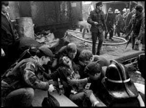 A woman wounded by an IRA bomb explosion in the city centre, is given first aid. G.B. Northern Ireland. Belfast.